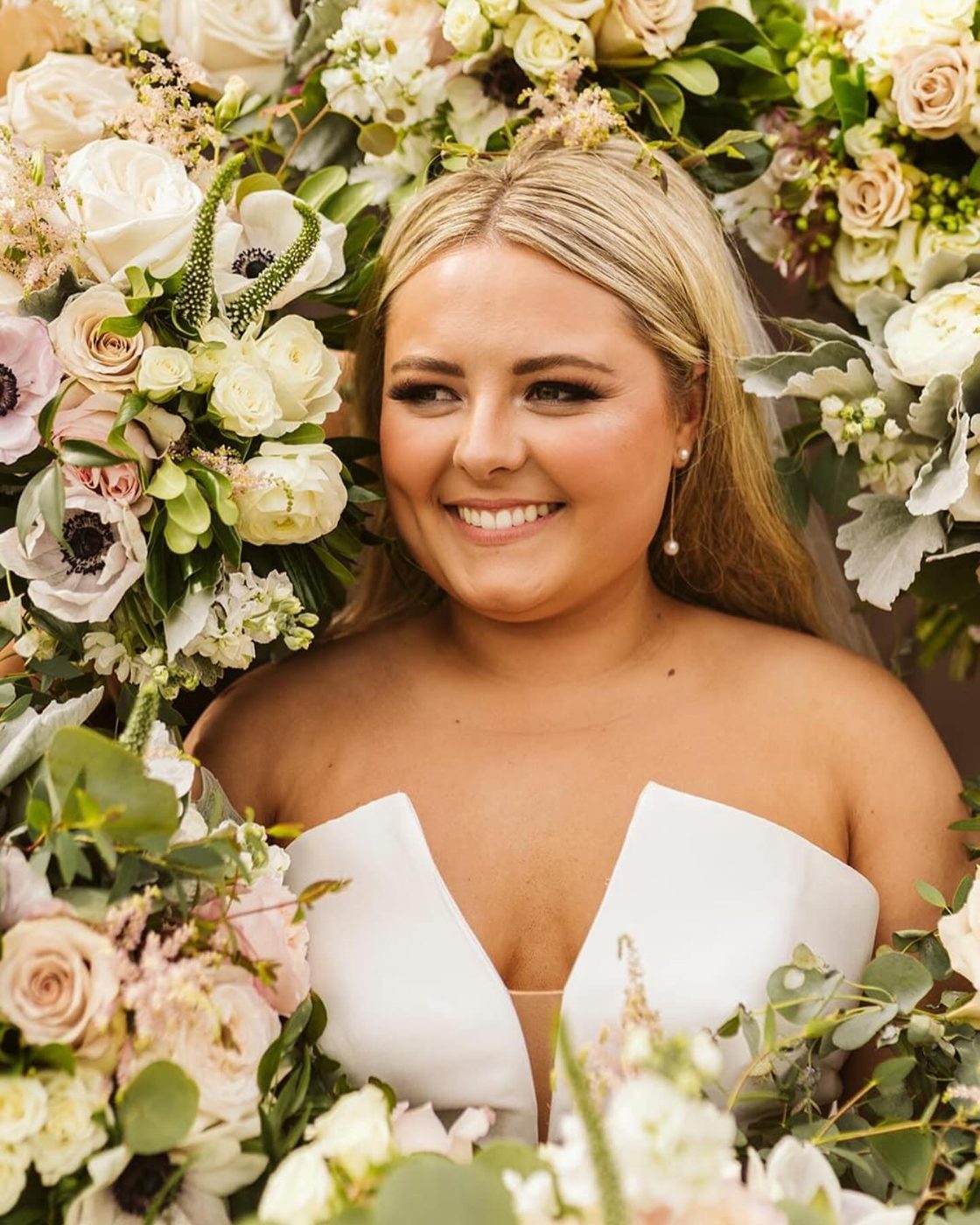 Bridal makeup by Catherine Vanlandingham - bride surrounded by florals